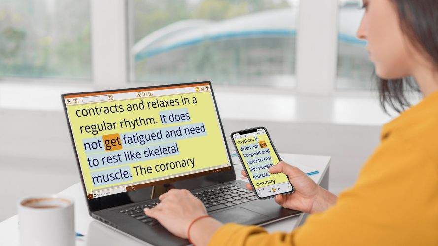 Person using EasyReader Premium on a laptop and phone. The book content is synchronised so it shows the same on both devices..