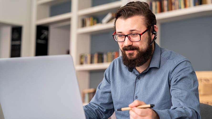 Teacher working at a laptop